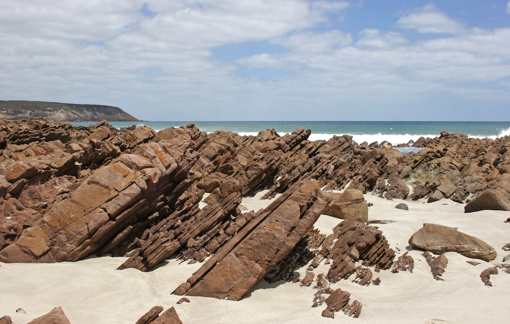 Interesting rock formations at the end of the beach. Source: Getty