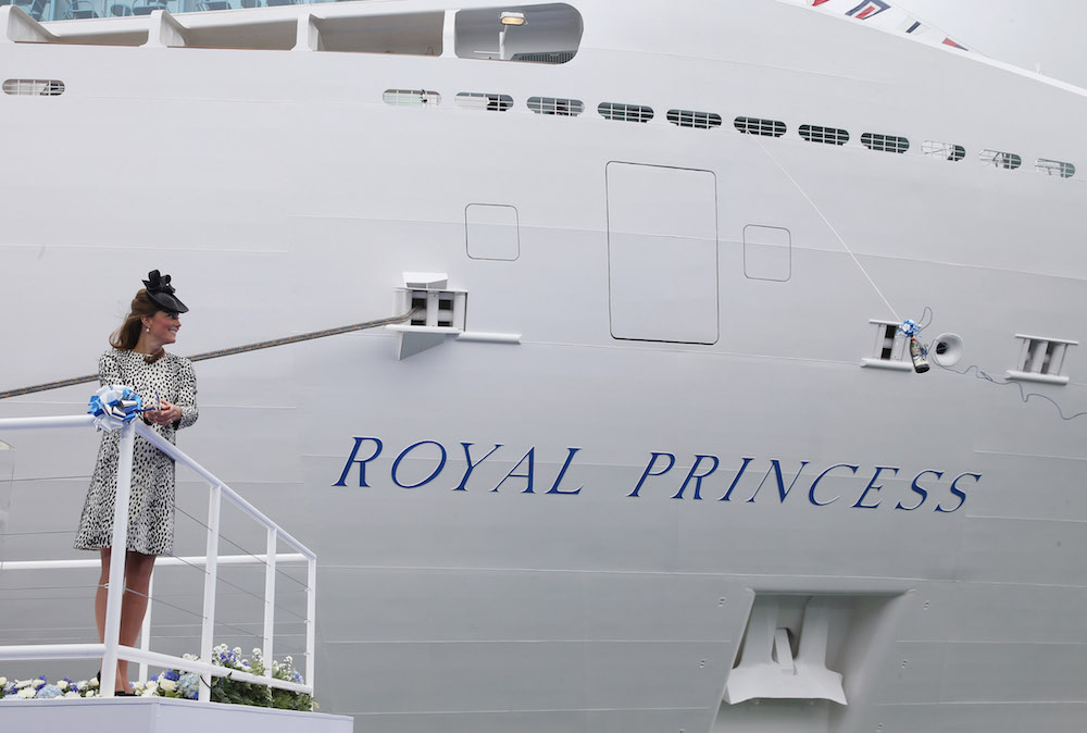 Catherine, Duchess of Cambridge cuts the rope to release the bottle of Champagne to officially name Princess Cruises's 'Royal Princess' in 2013. Source: Getty