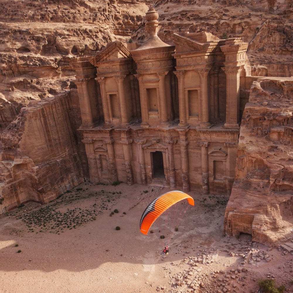 Paramotor pilot Stefan Fritz passes by the Monastery at Petra in Jordan (credit: Dan Burton)
