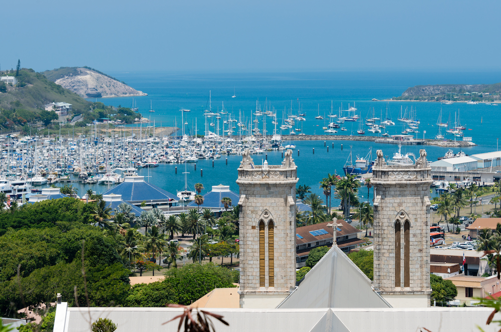 Looking out across Saint Joseph Cathedral to Moselle Bay in Noumea. Source: Getty